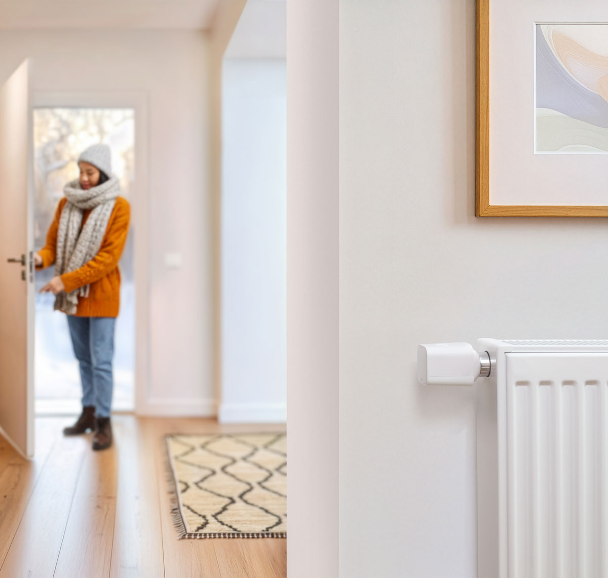 Eve Thermo at a radiator, woman coming home. 